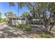 Neighborhood entrance with prominent signage and lush landscaping at 4043 Chalfont Ct, Las Vegas, NV 89121