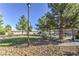 Landscaped common area with walking paths and relaxing pergola at 4043 Chalfont Ct, Las Vegas, NV 89121