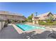 Inviting community pool with chaise lounge and clear blue water at 4043 Chalfont Ct, Las Vegas, NV 89121