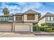 Charming two-story home featuring a two-car garage and lush landscaping at 4043 Chalfont Ct, Las Vegas, NV 89121