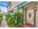 Welcoming front entrance with a decorative door, sidelights, and lush greenery at 4043 Chalfont Ct, Las Vegas, NV 89121