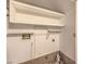 Utility room featuring upper storage shelves and hookups for a washer and dryer at 4043 Chalfont Ct, Las Vegas, NV 89121