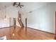 Open living space with vaulted ceilings, hardwood floors, staircase, and a fireplace at 4043 Chalfont Ct, Las Vegas, NV 89121