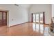 Spacious living room featuring hardwood floors, fireplace, and ample natural light at 4043 Chalfont Ct, Las Vegas, NV 89121