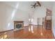 Inviting living room with hardwood floors, a fireplace, vaulted ceilings, and staircase at 4043 Chalfont Ct, Las Vegas, NV 89121