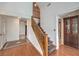 Open staircase with wood banister and carpeted steps leading upstairs at 4043 Chalfont Ct, Las Vegas, NV 89121