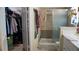 Well-lit bathroom with a shower, closet, and tile floors at 4432 Faberge Ave, Las Vegas, NV 89115