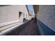 Side exterior featuring a brick walkway and an exterior wall at 4432 Faberge Ave, Las Vegas, NV 89115