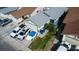 Aerial view of a single-Gathering home with a gray roof, a driveway, and a lush green lawn at 4432 Faberge Ave, Las Vegas, NV 89115