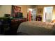 Comfortable main bedroom with ensuite bathroom and natural light at 4432 Faberge Ave, Las Vegas, NV 89115