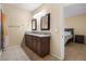 Bathroom with tile floors, shower, granite counters, and dual sinks at 4669 E Saint Louis Ave, Las Vegas, NV 89104