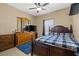 Bedroom with a ceiling fan, tile floors, and a large dresser at 4669 E Saint Louis Ave, Las Vegas, NV 89104