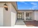 Elegant entryway with wrought iron gate, modern lighting, and desert landscape at 4669 E Saint Louis Ave, Las Vegas, NV 89104