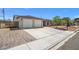 Charming single-story home featuring a wide driveway and low-maintenance landscaping at 4669 E Saint Louis Ave, Las Vegas, NV 89104