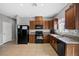 Efficient kitchen with tile floors, sleek appliances, and granite countertops at 4669 E Saint Louis Ave, Las Vegas, NV 89104
