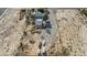 Aerial view of the buildings on the property and surrounding desert land at 4838 N Tioga Way, Las Vegas, NV 89149