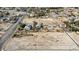Wide aerial view of homes in the distance and the property at 4838 N Tioga Way, Las Vegas, NV 89149