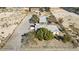 Desert home with a large parking area, lush landscaping, and fenced yard at 4838 N Tioga Way, Las Vegas, NV 89149