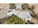 Charming home with well-maintained roof, lush trees, and fenced yard at 4838 N Tioga Way, Las Vegas, NV 89149