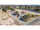 Large property with ample parking on a desert landscape, adjacent to a busy road at 4838 N Tioga Way, Las Vegas, NV 89149
