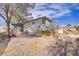 Wide shot of the backyard with dirt and debris at 4838 N Tioga Way, Las Vegas, NV 89149