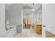 Bright bathroom with double sink vanity, soaking tub, and neutral tile at 4838 N Tioga Way, Las Vegas, NV 89149