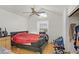 Bedroom with light wood floors, a ceiling fan, and a black leather bed frame at 4838 N Tioga Way, Las Vegas, NV 89149