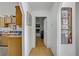 View of a hallway with wood floors and a water heater visible on the right at 4838 N Tioga Way, Las Vegas, NV 89149