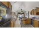Bright kitchen and dining area with a view of the backyard and stainless steel appliances at 4838 N Tioga Way, Las Vegas, NV 89149