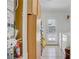 Laundry room features tile flooring, cabinetry, washer, dryer, and backyard access at 4838 N Tioga Way, Las Vegas, NV 89149