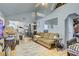 View of the living room featuring a large sofa, tile floors, and open floor plan at 4838 N Tioga Way, Las Vegas, NV 89149