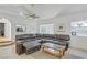 Spacious living room with a comfortable leather sectional sofa and decorative rug at 4838 N Tioga Way, Las Vegas, NV 89149