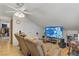 Upstairs living room features a ceiling fan and large TV at 4838 N Tioga Way, Las Vegas, NV 89149