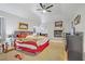 Spacious main bedroom with a ceiling fan, fireplace, and comfortable seating at 4838 N Tioga Way, Las Vegas, NV 89149