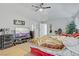 View of the large main bedroom with a ceiling fan and access to the ensuite bathroom at 4838 N Tioga Way, Las Vegas, NV 89149