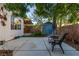 Relaxing backyard with patio area, shed, seating and mature trees at 5046 Great Abaco St, North Las Vegas, NV 89031