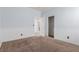Cozy bedroom with decorative trim, neutral carpet, and convenient access to the bathroom and closet at 5046 Great Abaco St, North Las Vegas, NV 89031