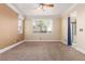 Spacious bedroom featuring a ceiling fan and an entrance to the bathroom at 5046 Great Abaco St, North Las Vegas, NV 89031
