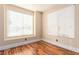 Spacious bedroom with two bright windows and wood flooring at 5046 Great Abaco St, North Las Vegas, NV 89031