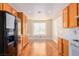 Bright kitchen features stainless steel refrigerator, white countertops, and wood flooring at 5046 Great Abaco St, North Las Vegas, NV 89031