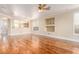 Spacious living room with hardwood floors, built-in shelves, and backyard views at 5046 Great Abaco St, North Las Vegas, NV 89031