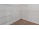 Walk-in closet fitted with metal shelving system to maximize storage at 5046 Great Abaco St, North Las Vegas, NV 89031