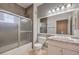 Bathroom featuring a shower-tub combo with tiled walls and a vanity with marble countertop at 5250 S Rainbow Blvd # 2046, Las Vegas, NV 89118