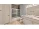 Bathroom featuring a shower-tub combo and white marble vanity at 5250 S Rainbow Blvd # 2046, Las Vegas, NV 89118