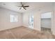 Bedroom featuring neutral carpet, a ceiling fan, and an ensuite bathroom and closet at 5250 S Rainbow Blvd # 2046, Las Vegas, NV 89118