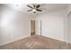 Neutral-toned bedroom with carpet flooring and sliding closet doors at 5250 S Rainbow Blvd # 2046, Las Vegas, NV 89118