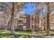 Two-story apartment building with lush lawns and mature trees at 5250 S Rainbow Blvd # 2046, Las Vegas, NV 89118