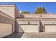 View of the garage of the condo with neutral paint and tiled roof at 5250 S Rainbow Blvd # 2046, Las Vegas, NV 89118