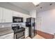 Kitchen featuring stainless steel appliances, white cabinets, and granite countertops at 5250 S Rainbow Blvd # 2046, Las Vegas, NV 89118