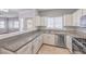 Modern kitchen with stainless steel appliances, white cabinets, and granite countertops at 5250 S Rainbow Blvd # 2046, Las Vegas, NV 89118